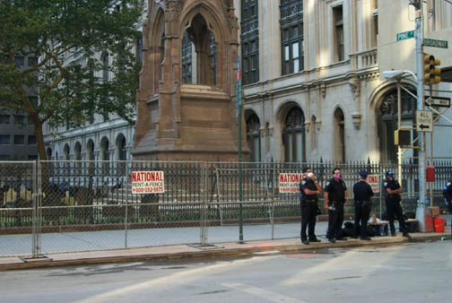 04 Policemen wearing respirators in front of Trinity Church graveyard